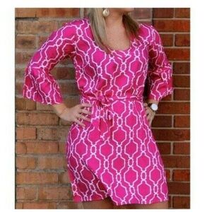 Escapada pink and white geometric print dress with bell sleeves and ribbon belt